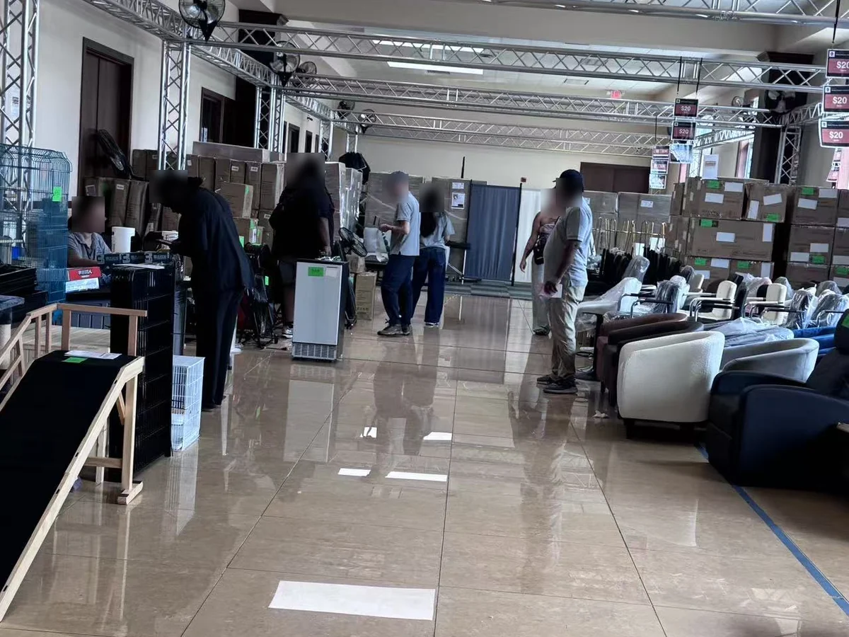 The checkout end of the Cube-Age Houston sale floor with rows of wrapped seating on the right
