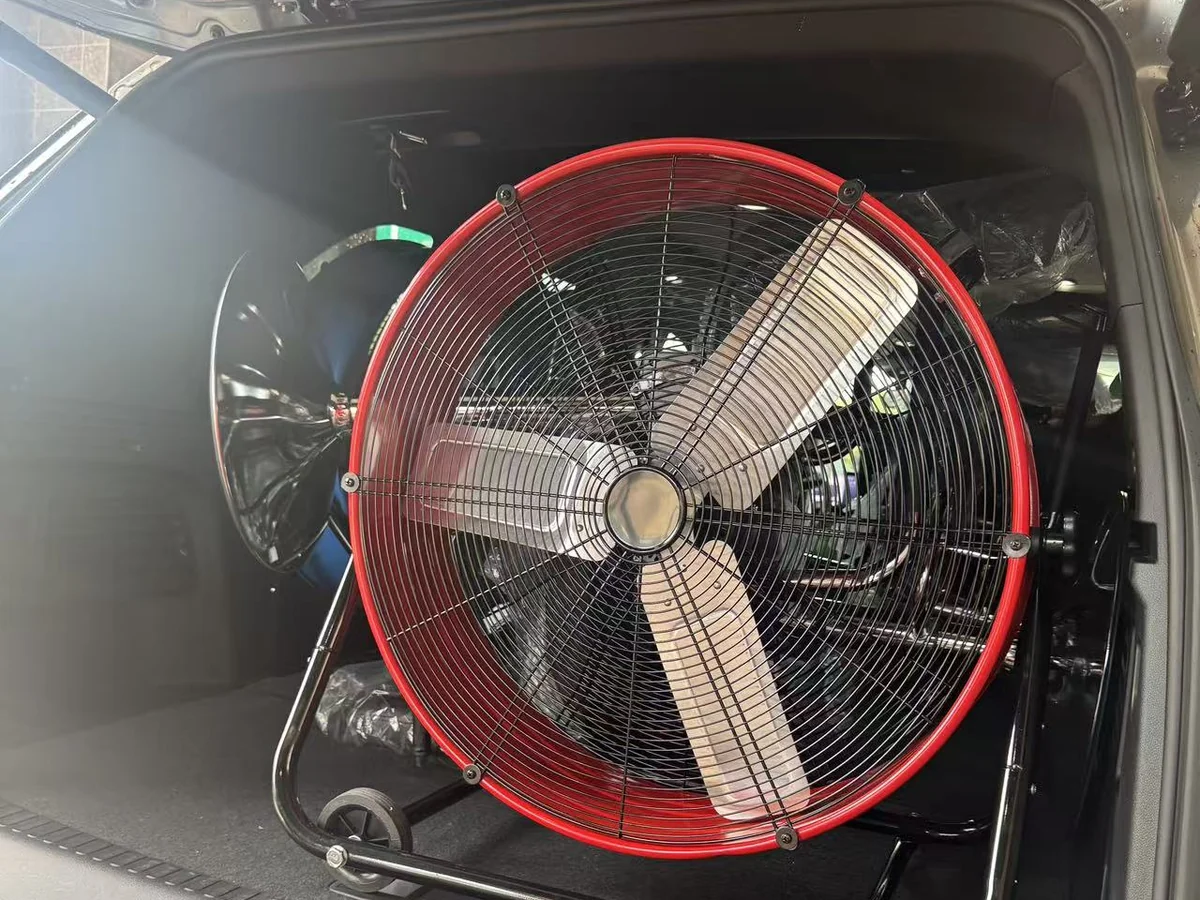 A drum fan loaded into the back of an SUV outside the Cube-Age Houston sale