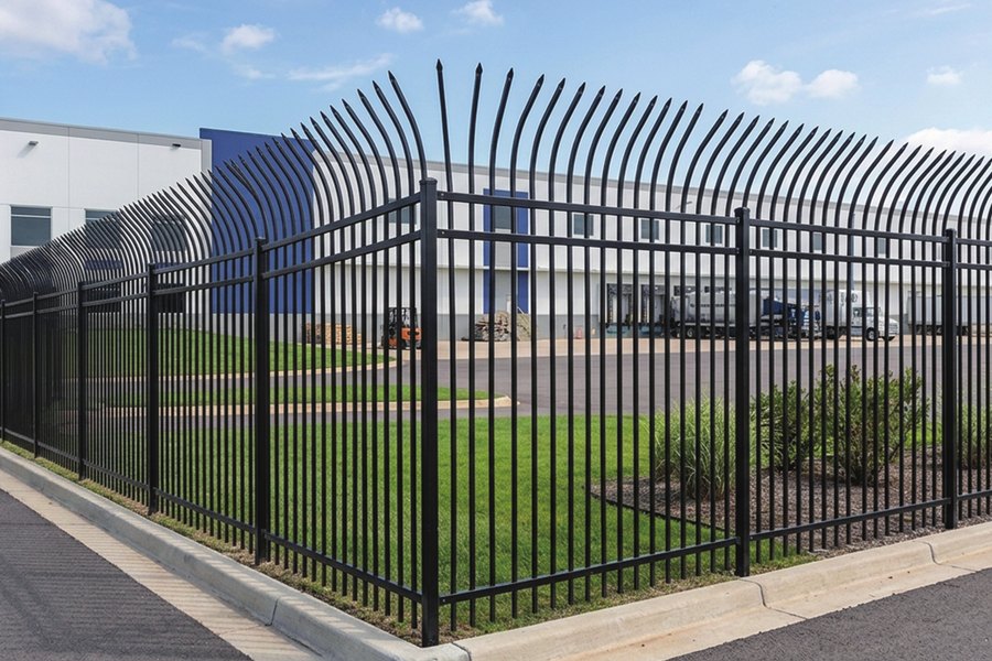 Curved top steel security fence at a commercial site