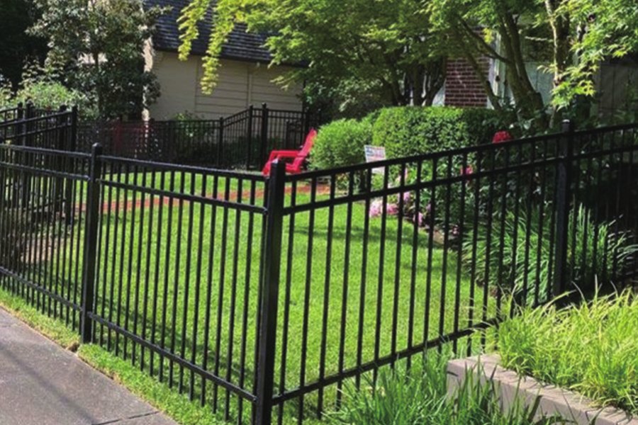 Flat top steel fence around a garden