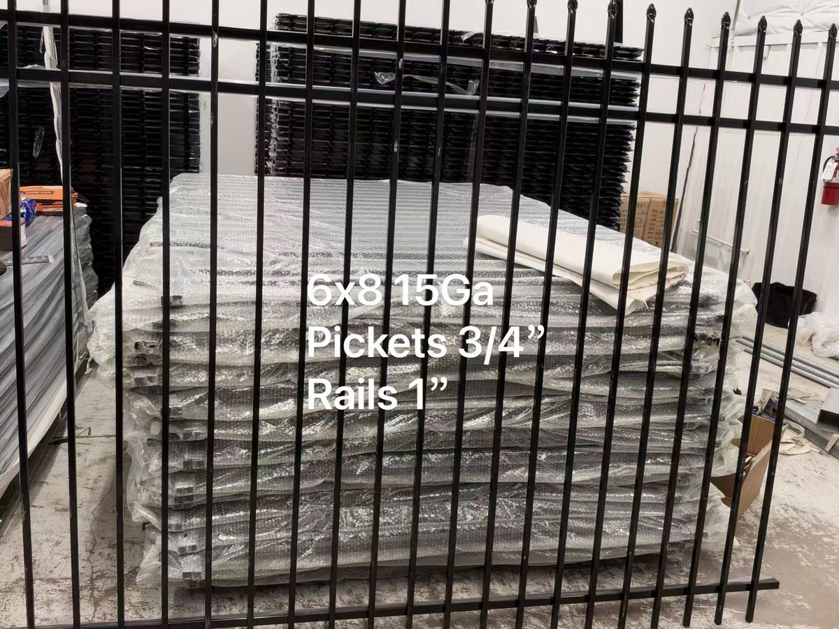 Bubble-wrapped pallet of 6 by 8 foot 15 gauge steel fence panels in the Cube-Age Houston warehouse