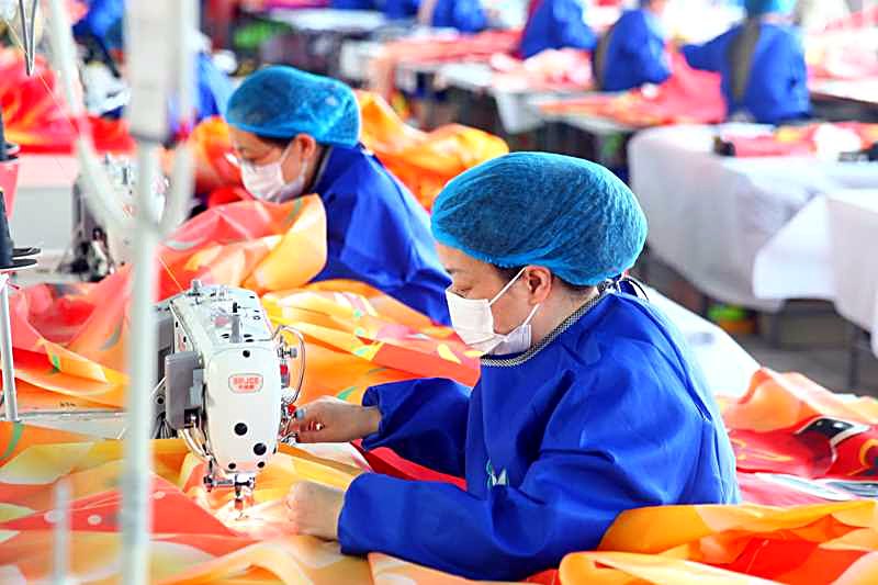 The sewing line at the kite factory, stitching hems and reinforcement
