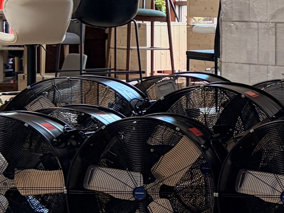 Industrial drum fans lined up on our Houston warehouse floor