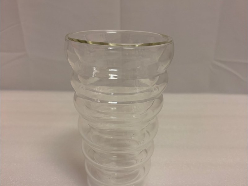 A ribbed double-wall glass cup