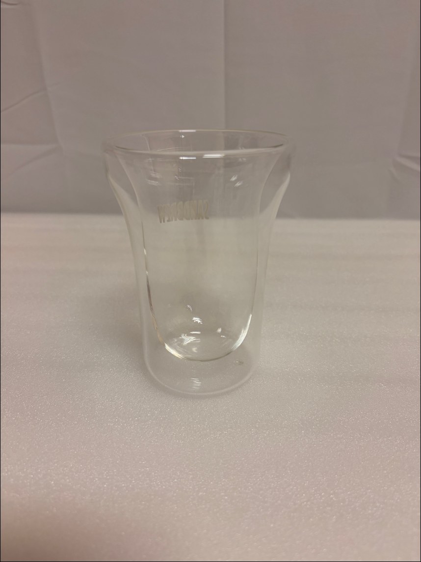 A straight-sided double-wall glass cup, middle size